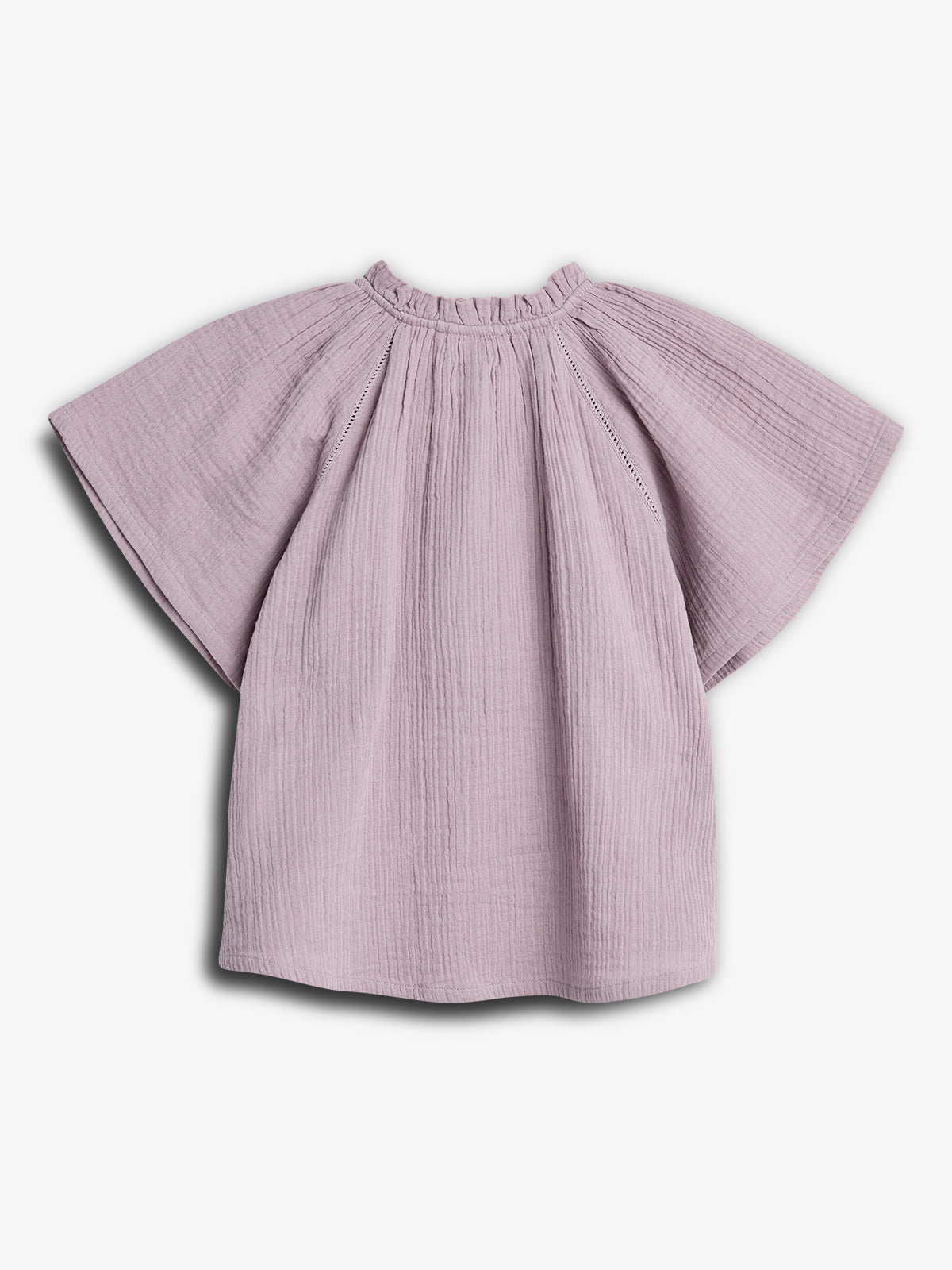 A lavender blouse with wide, short sleeves and a gathered neckline lies flat against a white background, showcasing its soft, textured fabric.