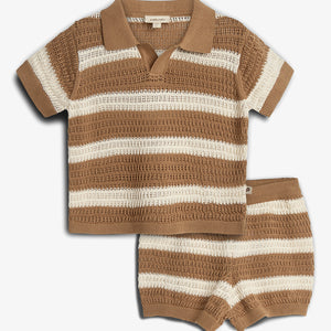 A crocheted, short-sleeved shirt and shorts set features alternating brown and cream horizontal stripes. The shirt has a collar and is placed on a plain white background.