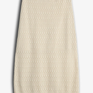 A beige, knee-length knit skirt features a geometric lace pattern, displayed flat against a plain white background.