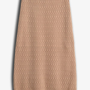 A beige, knee-length skirt with a zigzag knit pattern is placed against a plain white background, highlighting its textured design and scalloped hem.