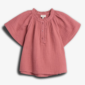 A pink, short-sleeved blouse with buttons down the front, displayed against a plain white background. It has a textured fabric and round neckline, creating a casual, soft appearance.