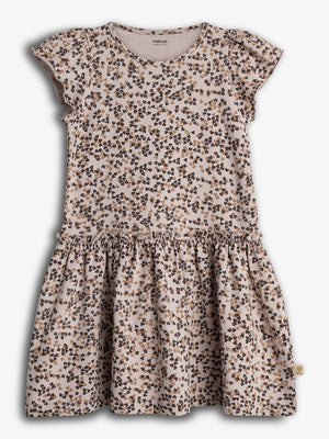 A short-sleeved girl's dress with a ruffled skirt features a pattern of small brown and black bows. It hangs against a plain white background.