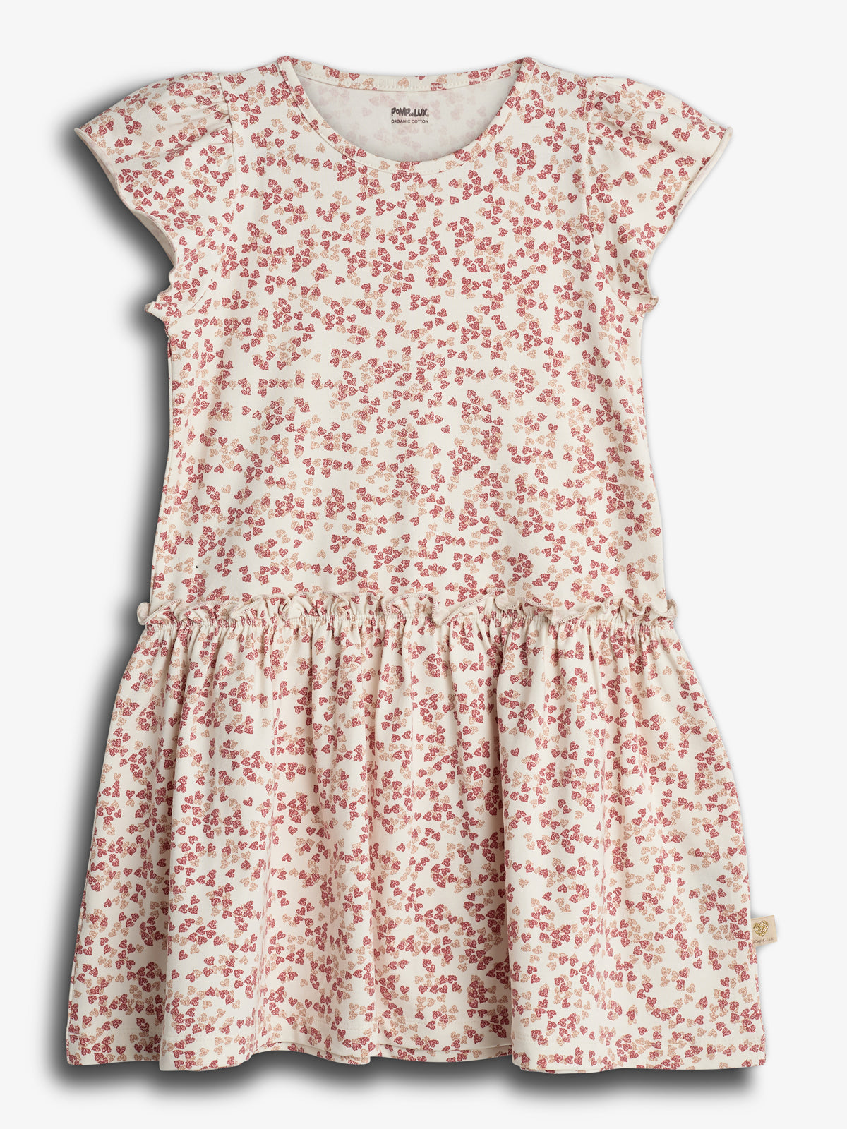 Een kinderjurk in wit met roze bloemmotief, liggend plat, zonder mensen. De jurk heeft korte mouwen en een gerimpelde rok, tegen een effen witte achtergrond. "Pomp de lux 134/140" staat op het label.