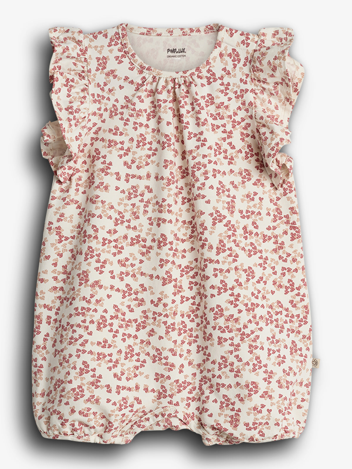 Rompertje - Het rompertje heeft een vrolijk bloemetjespatroon in rood en beige. De ruches accentueren de schouders, in een neutrale achtergrond. Tekst: "POMP.LUX ORGANIC COTTON".