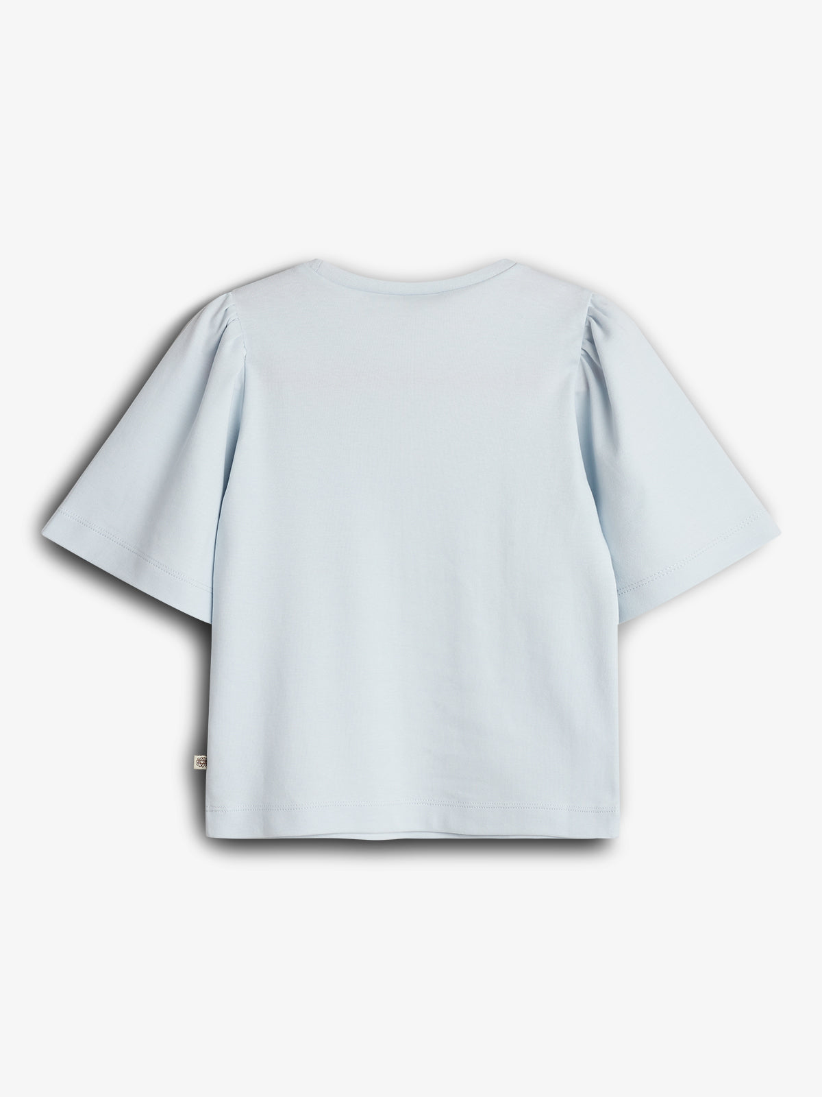 A light blue T-shirt with short sleeves is displayed on a white background. The shirt has a round neckline and slightly puffy sleeves, emphasizing a casual design.