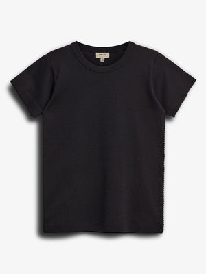 A black short-sleeve T-shirt with a round neckline is laid flat against a white background. A label inside the collar reads "pura vida."