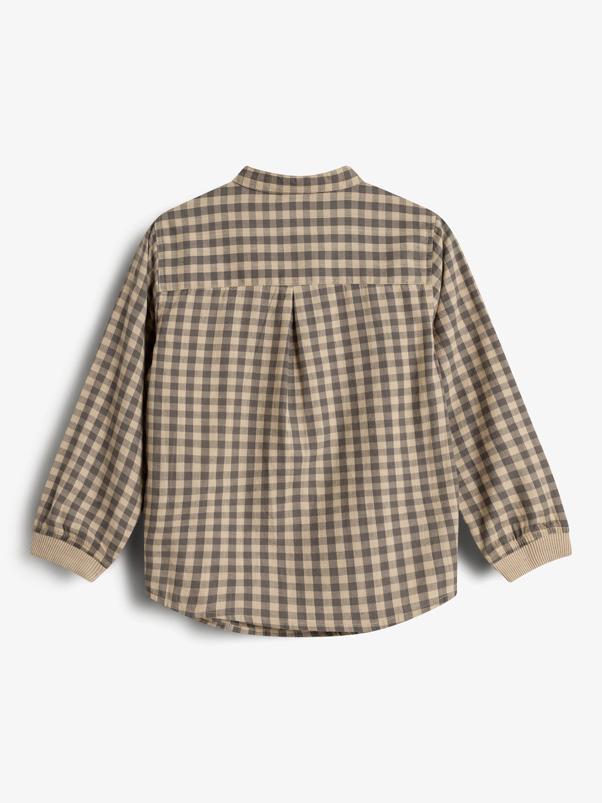 Geruite blouse zonder zichtbaar label, in bruin en beige kleurenpatroon. De blouse ligt plat, met lange mouwen die eindigen in elastische manchetten, tegen een witte achtergrond.